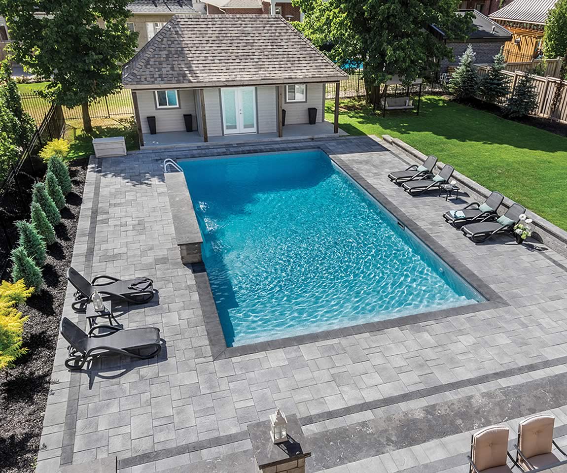 Image of poolside featuring Trevista 50 Textured (Grey Mix) product with Barollo Round Edge Coping (Ultra Black)